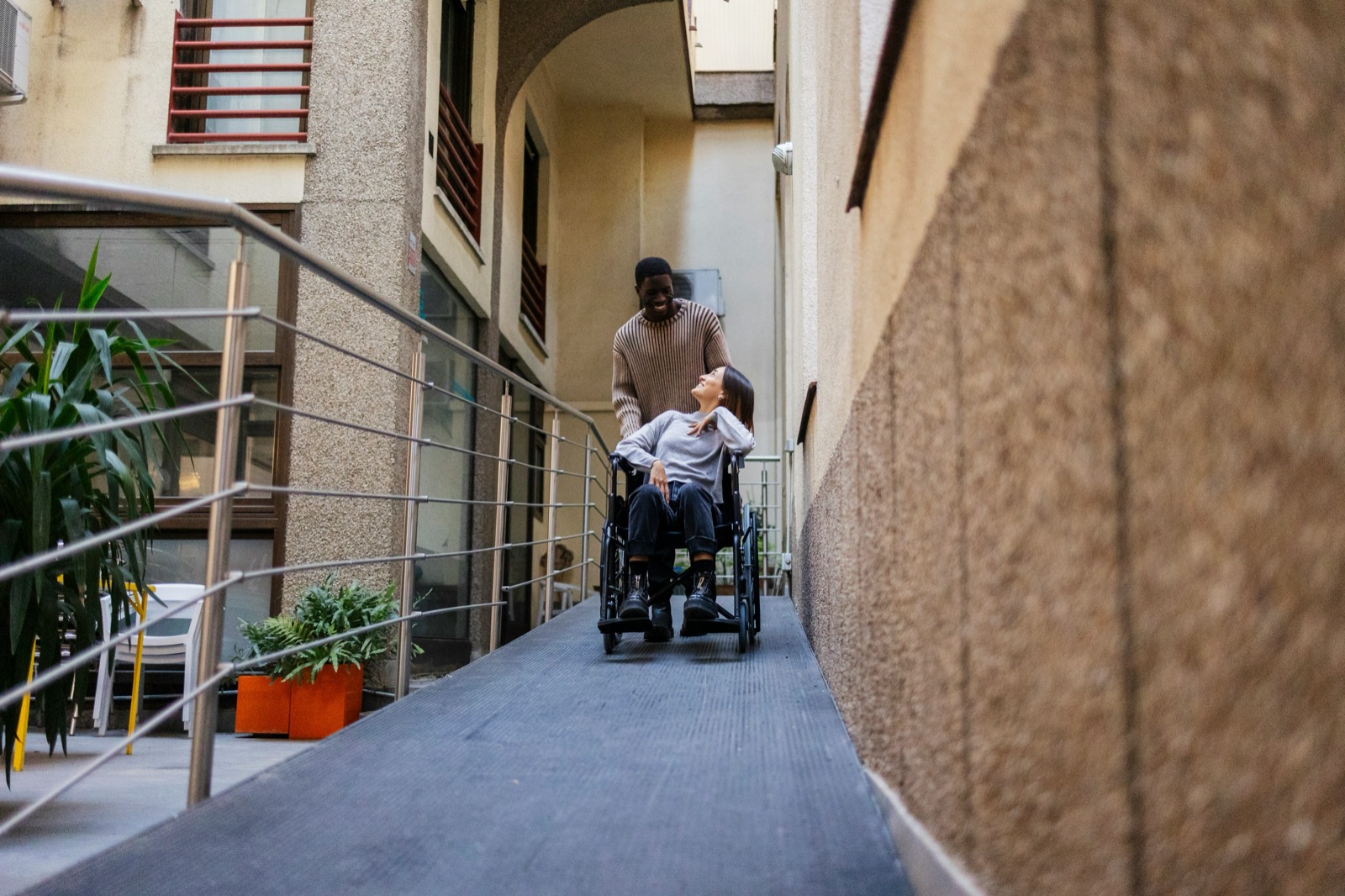 An accessible entrance ramp with handrails